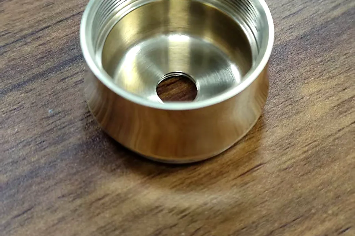 Bore and internal thread detail on a CNC machined brass sleeve
