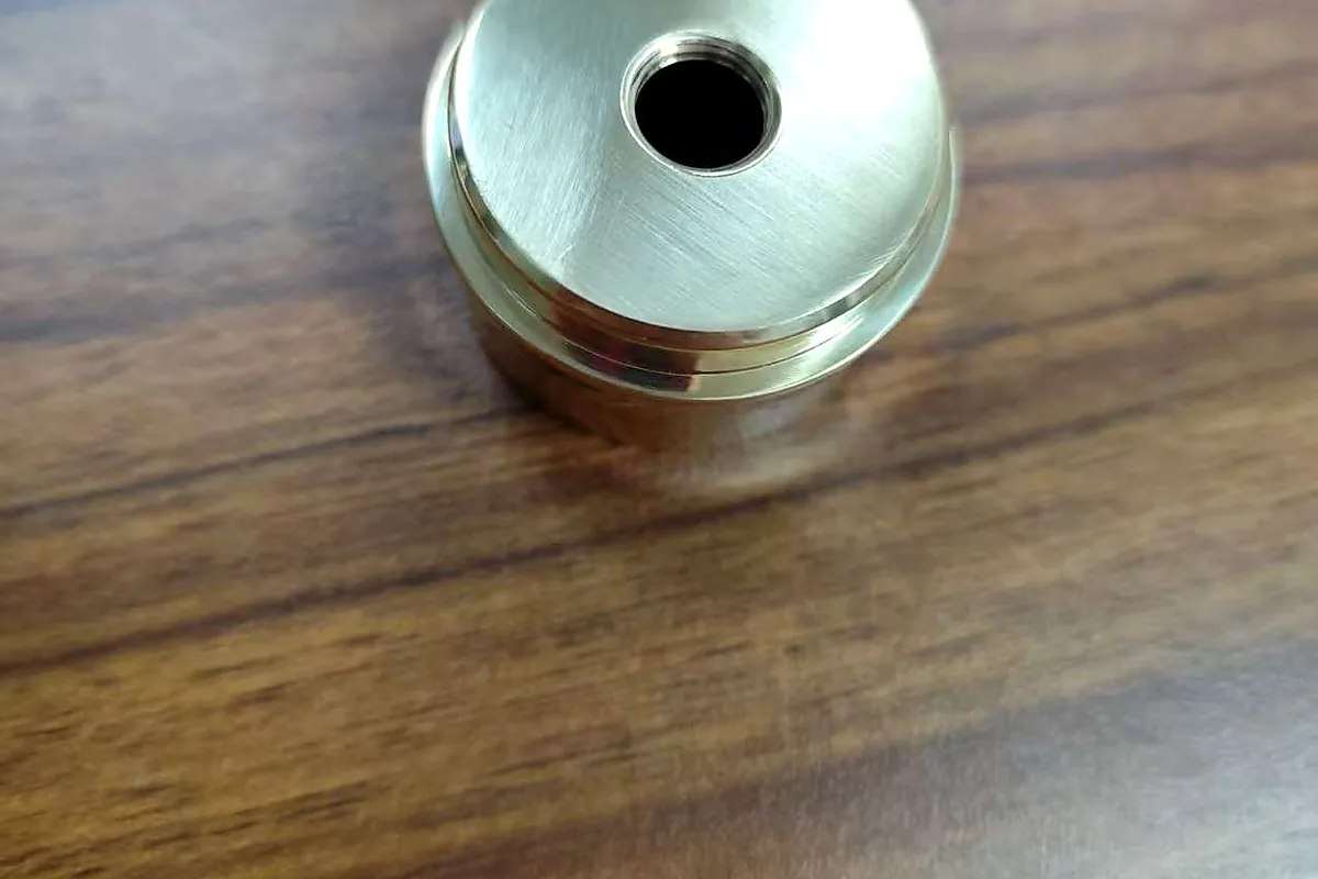 Top hole and polished surface view of a brass threaded sleeve